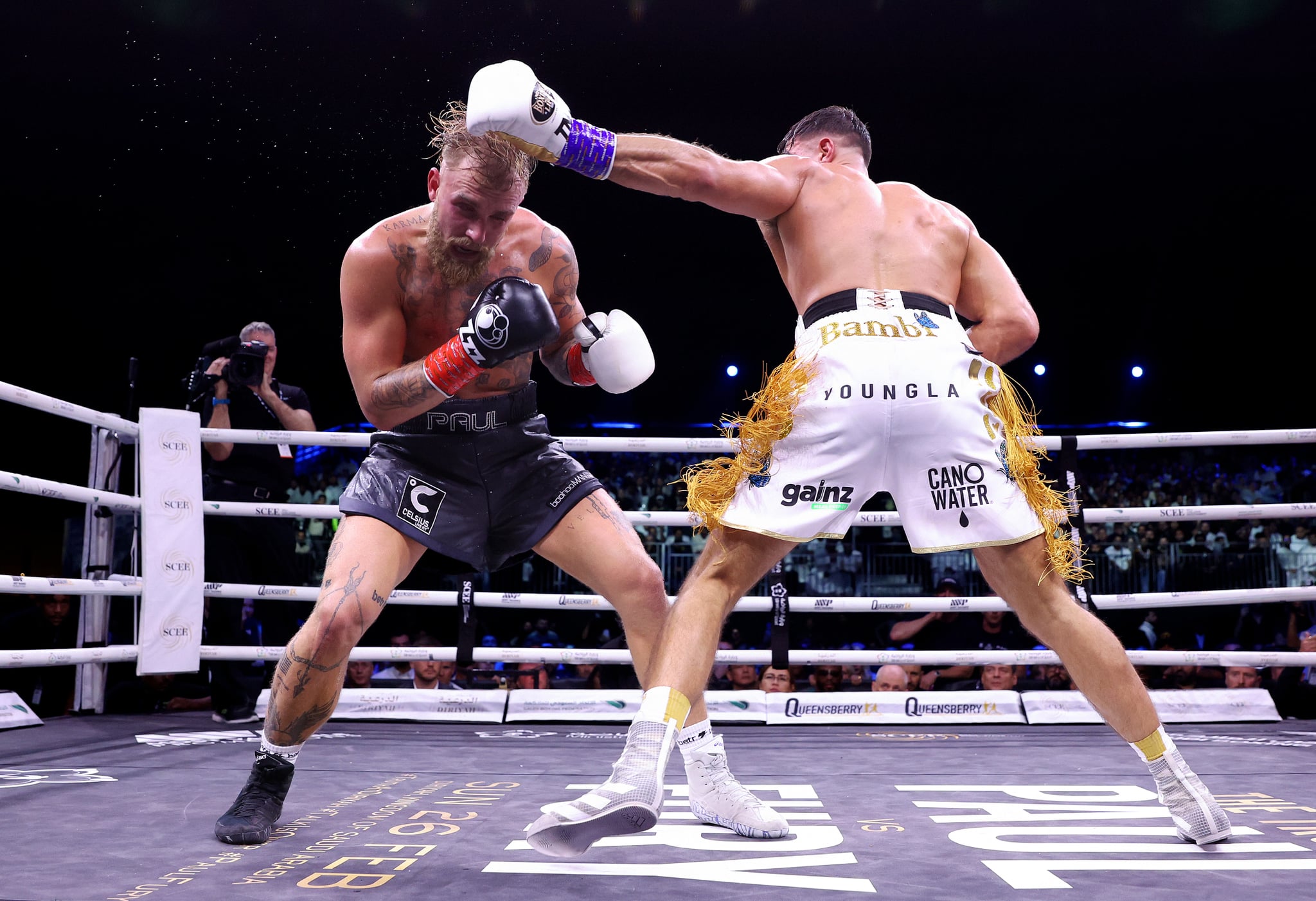 RIYADH, SAUDI ARABIA - FEBRUARY 26: Jake Paul exchanges punches with Tommy Fury during the Cruiserweight Title fight between Jake Paul and Tommy Fury at the Diriyah Arena on February 26, 2023 in Riyadh, Saudi Arabia. (Photo by Francois Nel/Getty Images)