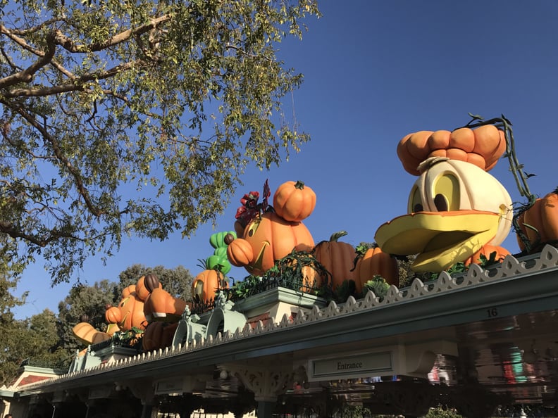 The park entrance is complete with pumpkin Mickey and friends.