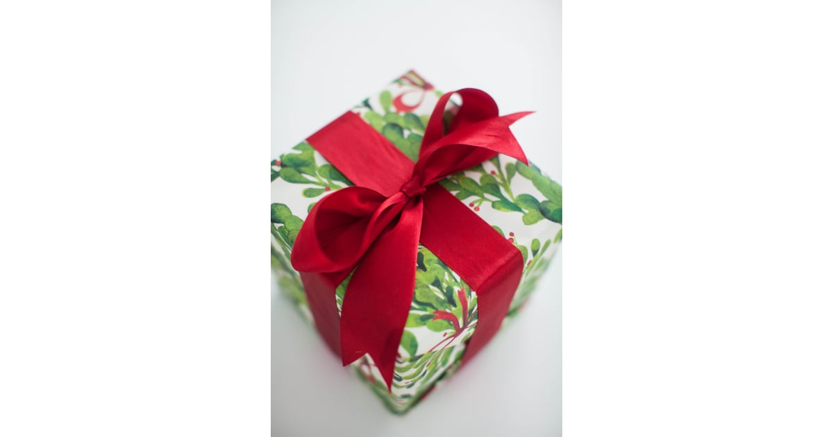 Use Leftover Wrapping Paper as a Photo Booth Backdrop How to Throw an