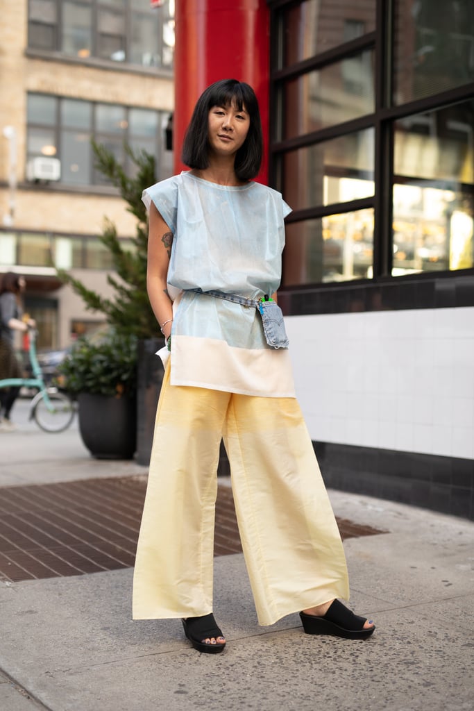 A belt bag and black slides keep pretty pastels from feeling overly sweet.