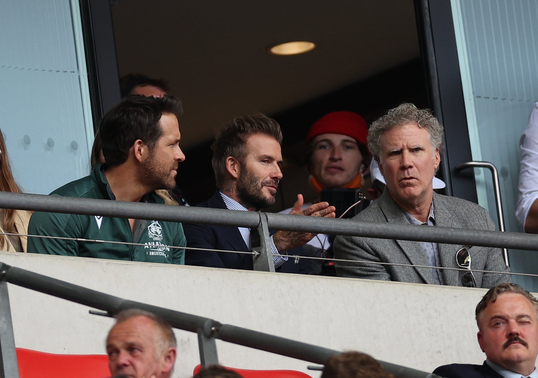 LONDON, ENGLAND - MAY 22: (L-R), Wrexham Owner & Hollywood actor Ryan Reynolds, Ex England Footballer David Beckham and Hollywood actor Will Ferrell in the tribune during the Buildbase FA Trophy Final between Bromley and Wrexham at Wembley Stadium on May 22, 2022 in London, England. (Photo by Eddie Keogh - The FA/The FA via Getty Images)