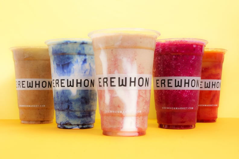 Erewhon smoothies photographed against a yellow background. From left to right: Activated, Coconut Cloud, Hailey Biebers Strawberry Glaze, Pitaya, and Turmeric Crush.