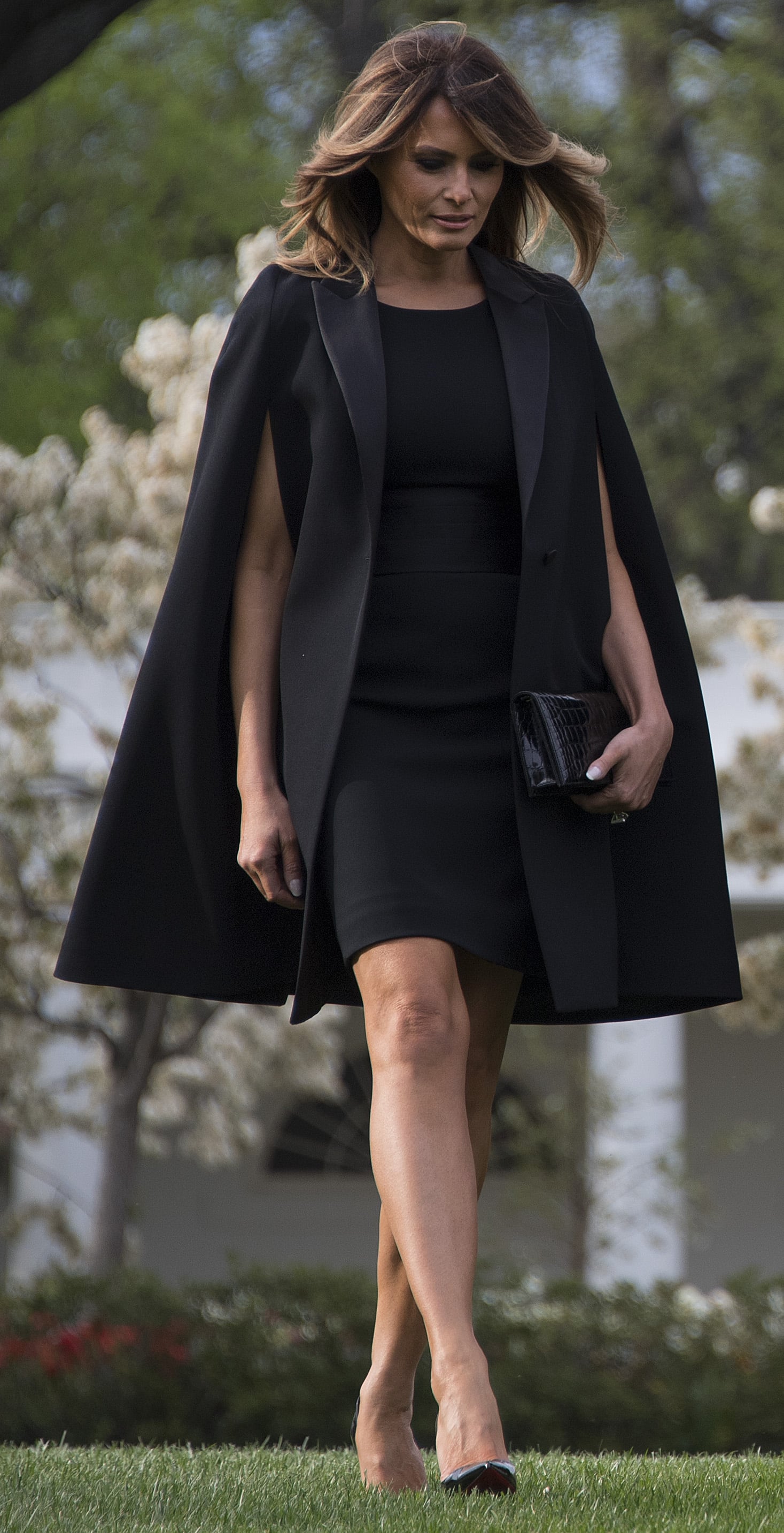 melania red cape dress Melania wears gown by Meghan's designer at dinner for Charles, Camilla