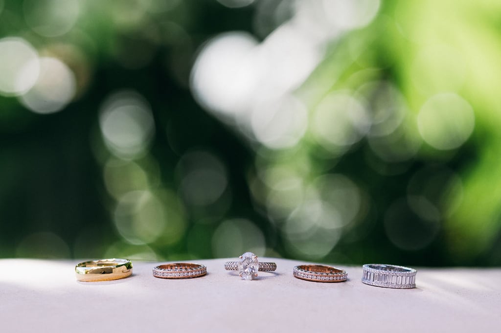 Whitney completed her engagement ring with three Tacori wedding bands during the ceremony.
