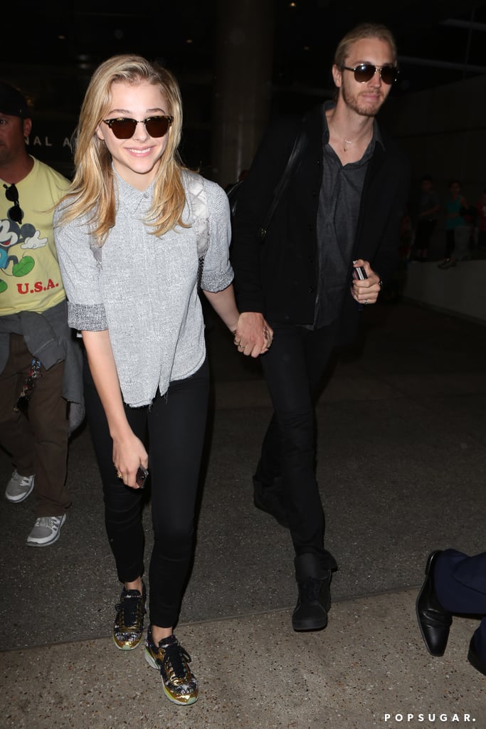 Chloë Moretz held hands with her brother Trevor at LAX on Thursday.
