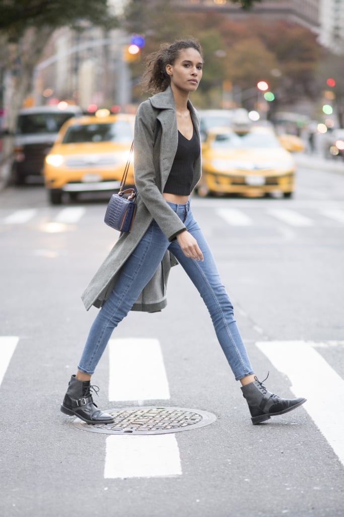 Style Your Boots With a Trench Coat, a Black Crop Top, and Skinny Jeans