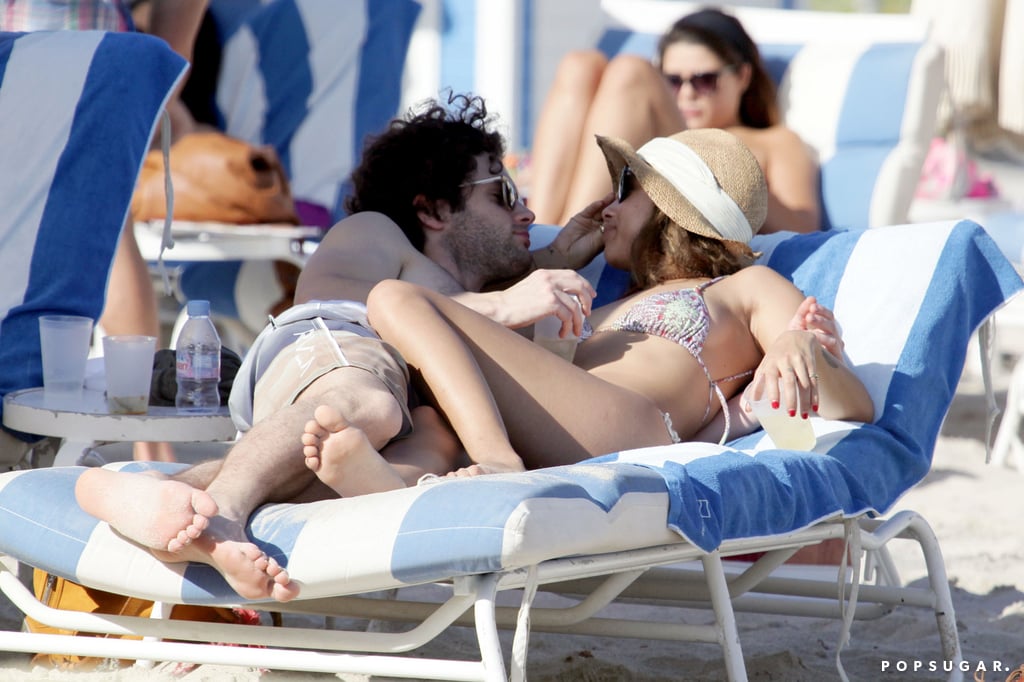 Bikini-clad Zoe Kravitz cuddled with shirtless Penn Badgley in Miami during a vacation in December 2011.