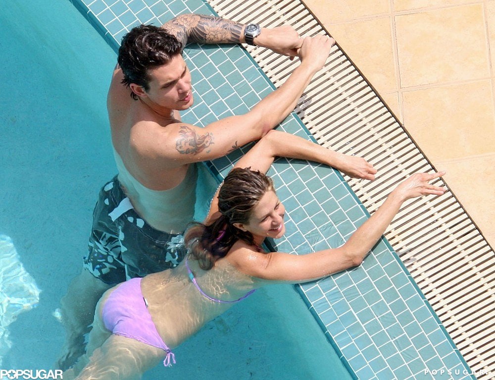 Jennifer floated in the pool alongside then-boyfriend John Mayer in May 2010.