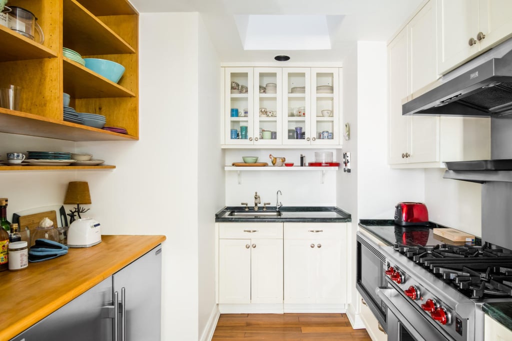 Amy's kitchen packs a powerful punch into a small space; it has a Wolf 4-burner range, two under-counter Sub-Zero refrigerators, beautiful cabinetry, and a Miele dishwasher. As if the appliances weren't enough, a skylight floods the room with natural light.