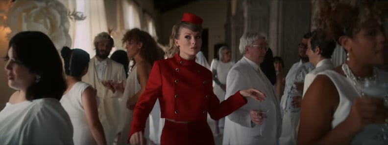 Taylor Swift Wearing a Red Server Uniform