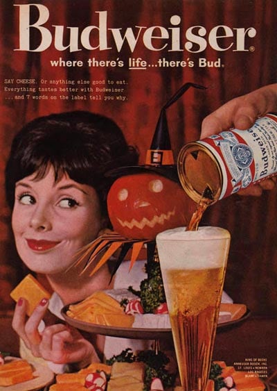 "SAY CHEESE. Or anything else good to eat. Everything tastes better with Budweiser," reads this ad. Next time, ditch the wine and have a beer and cheese party.