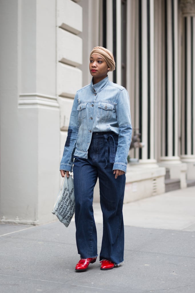 For a fresh take on double denim, half-tuck a denim shirt into wide-leg jeans and finish with bright red shoes.