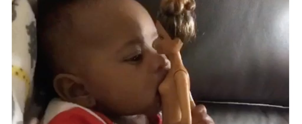 Baby Trying to Breastfeed Off a Naked Barbie Doll