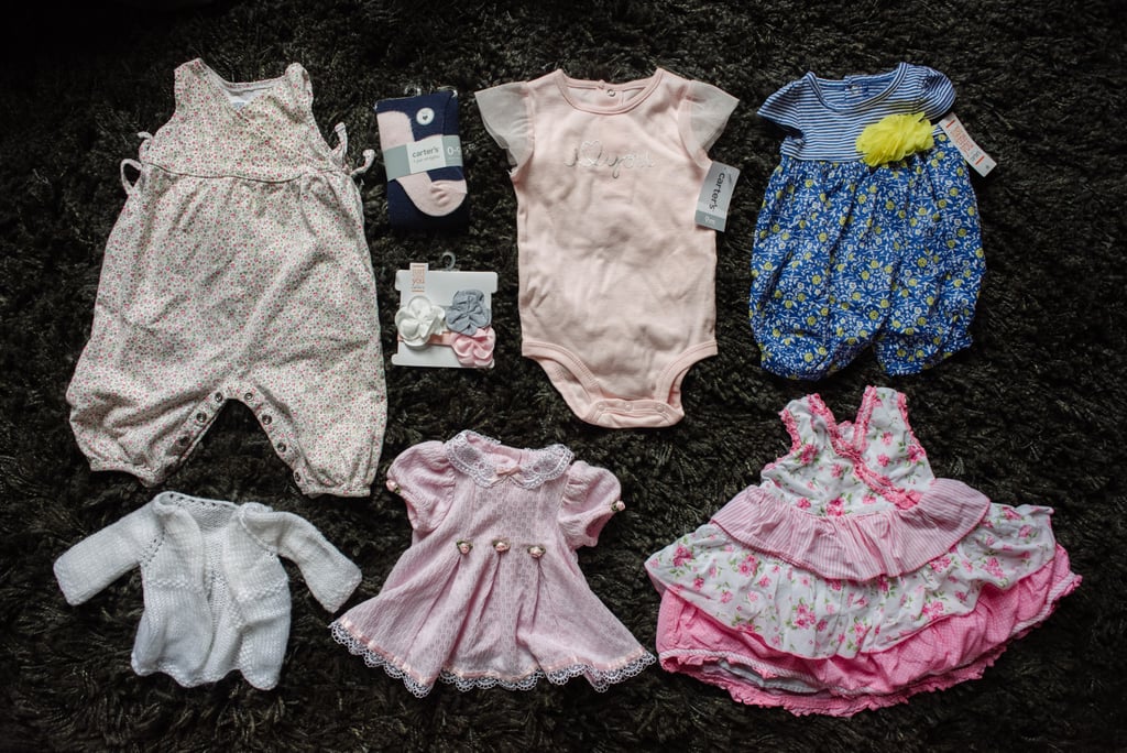 "Unworn baby clothes that were sitting in a bin in Abby's room. Many still had the tags on them."