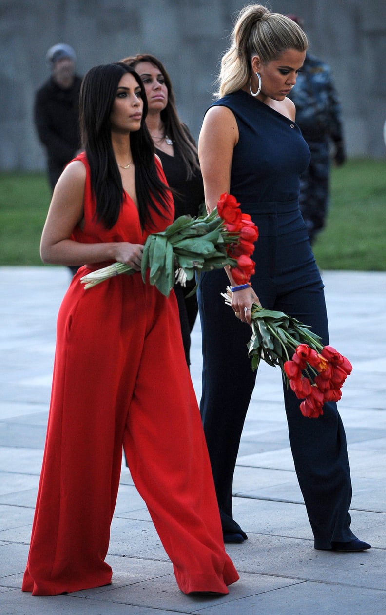 Kim and Khloé donned contrasting colorful jumpsuits.
