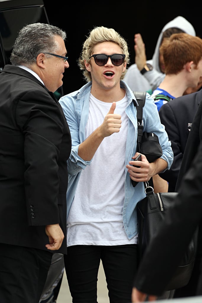 One Direction's Niall Horan gave a thumbs-up as he landed in Sydney, Australia, on Tuesday.