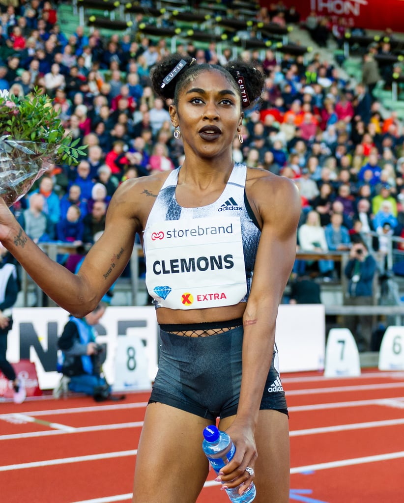 Wearing space buns with "cutie" hair clips and dark lipstick at a Diamond League event in 2019.