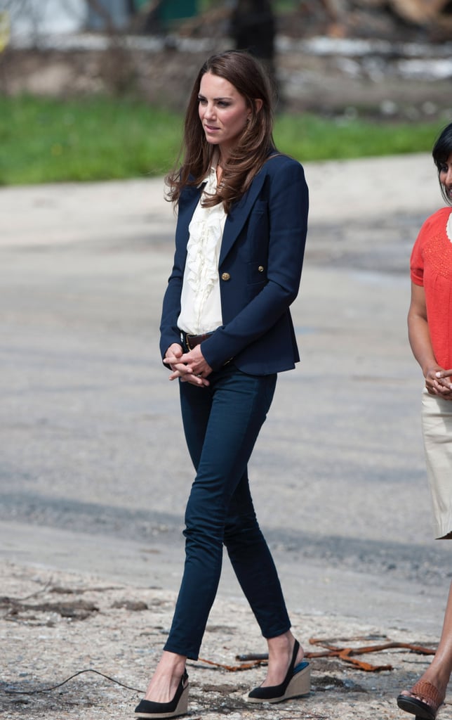 Kate made sure her outfit appeared feminine with a white ruffled blouse.