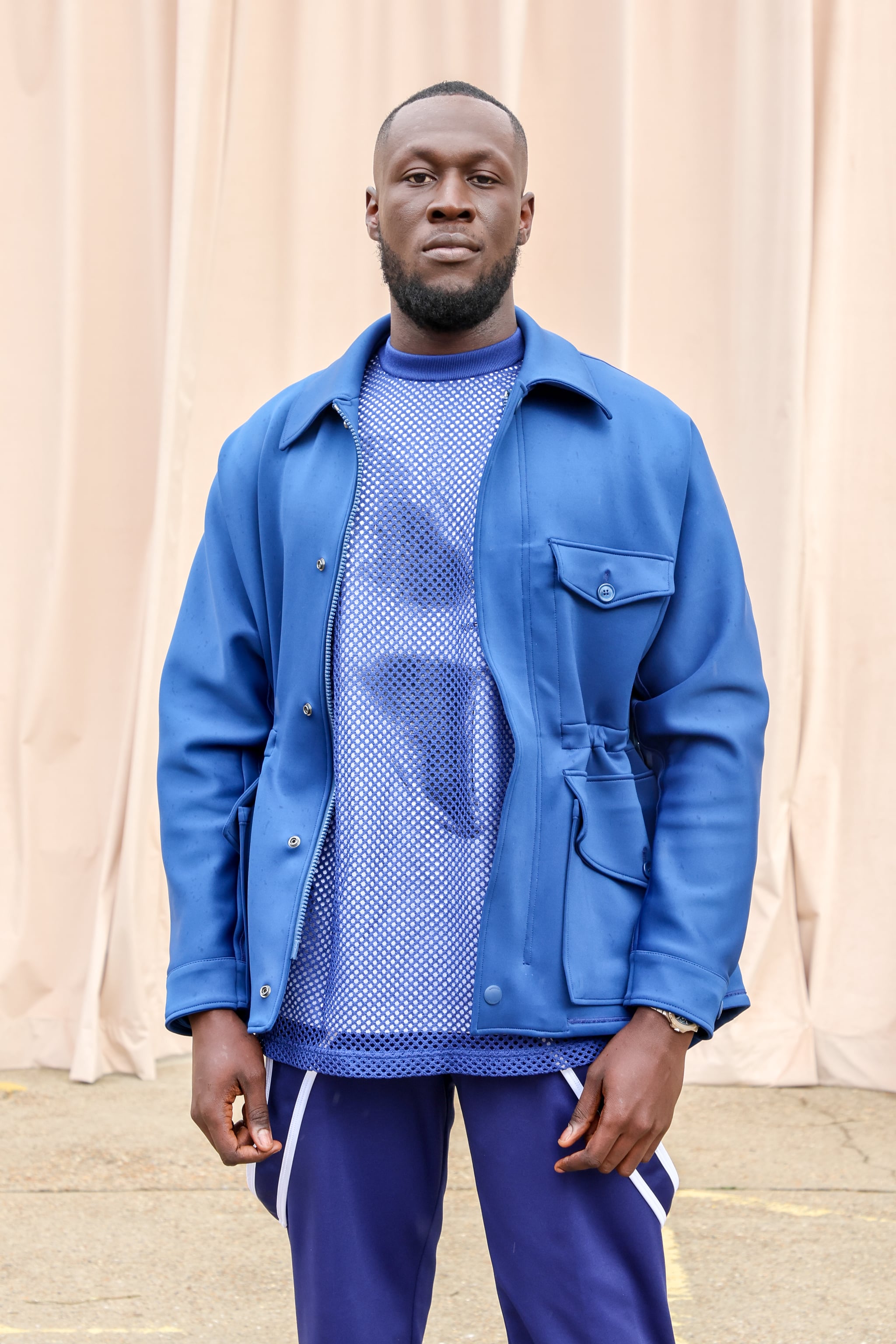 LONDON, ENGLAND - SEPTEMBER 26: Stormzy attends the Burberry Spring/Summer 2023 runway show in Bermondsey on September 26, 2022 in London, England. (Photo by David M. Benett/Dave Benett/Getty Images for Burberry)