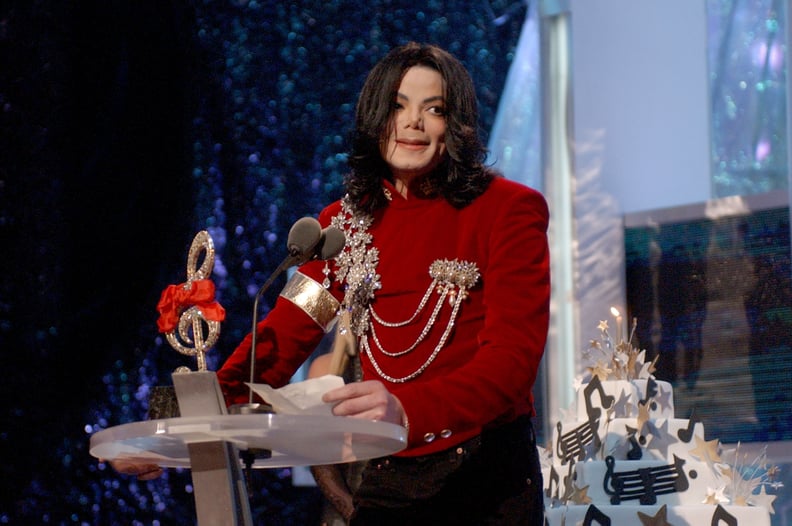 Michael Jackson speaks after Britney Spears presented Michael with a birthday cake at the 2002 MTV Video Music Awards (Photo by KMazur/WireImage)