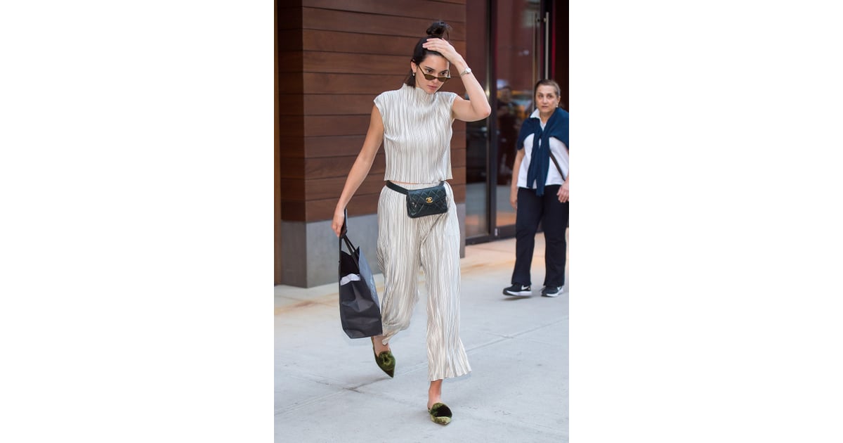 Kendall's slinky, silvery two-piece set was broken up by her Chanel ...