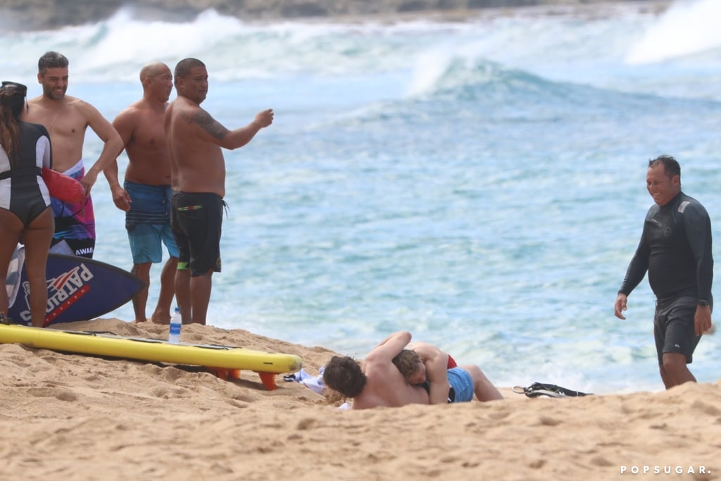 Charlie Hunnam and Garrett Hedlund Wrestle in Hawaii Photos