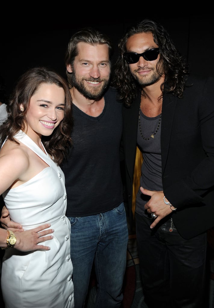 Game of Thrones stars Emilia Clarke, Nikolaj Coster-Waldau, and Jason Momoa posed together at the HBO panel in 2011.