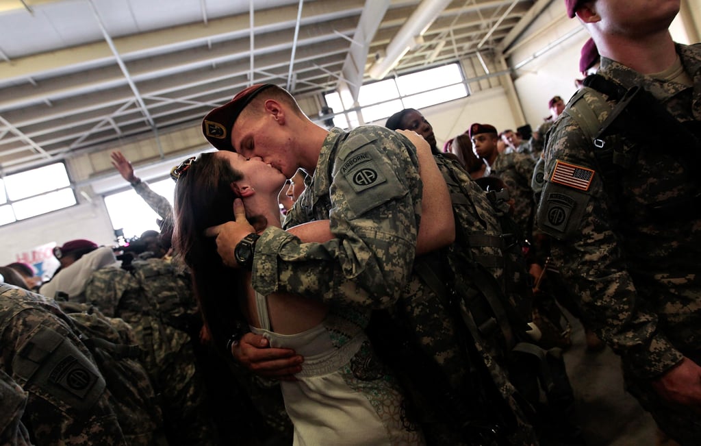Sgt. Patrick Hopkins embraced his fiancée, Cara Benz, when he returned from a yearlong tour in Iraq with the US Army's 82nd Airborne Division on July 30, 2010, in Fort Bragg, NC.