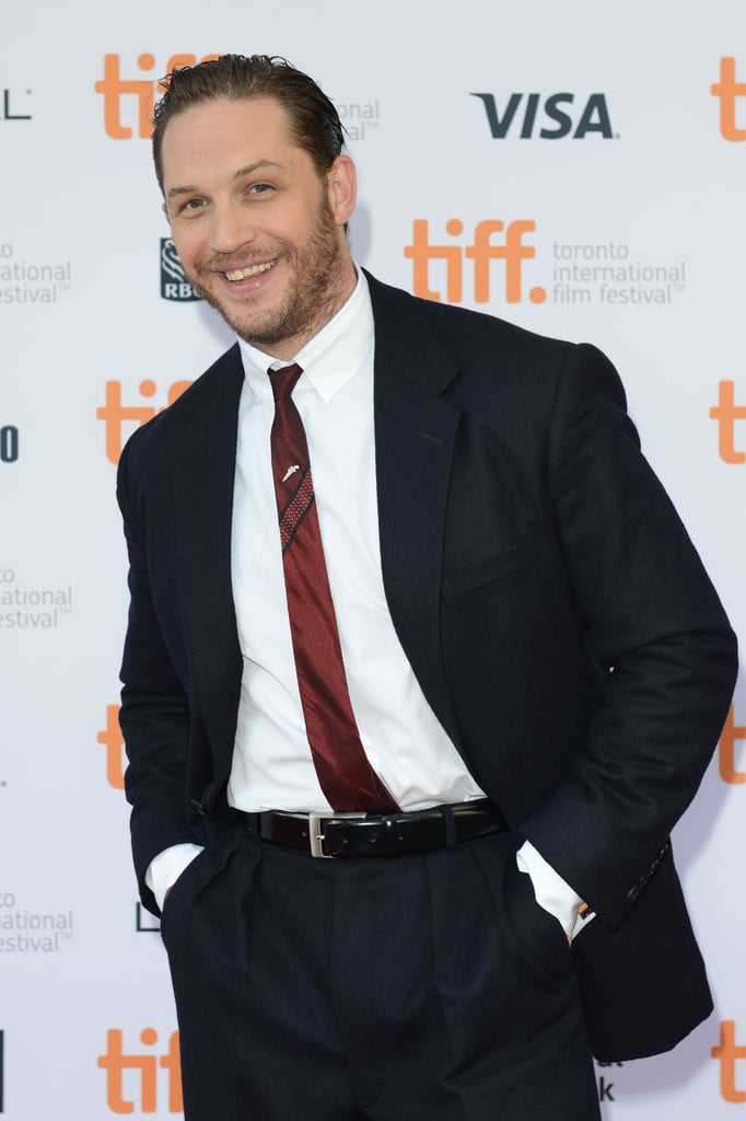 Tom Hardy had a wide grin at the premiere of The Drop.