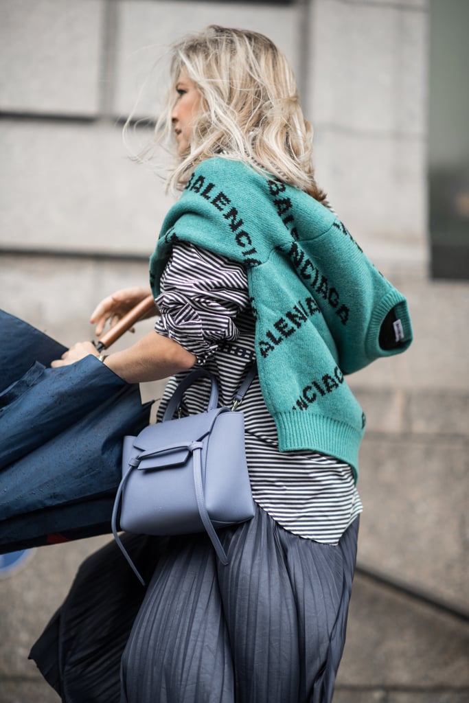 Add a jumper to your outfit to get in on the logo trend. Who says you have to wear your favourite designer on your bag when you can wear it on your sleeve?