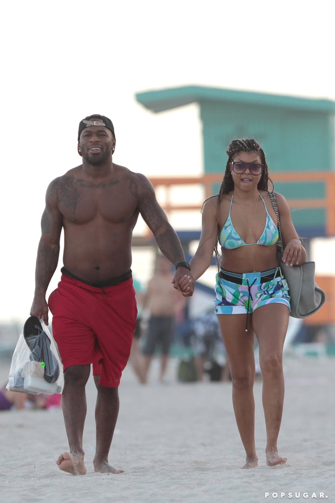 Is Cookie Lyon getting some offscreen love? Taraji P. Henson hit the beach with a mystery man in Miami on Monday who was later identified as NFL star Kelvin Hayden. The 32-year-old cornerback is currently a free agent but has previously played for the Chicago Bears and Indianapolis Colts. In addition to looking amazing in a printed Emilio Pucci top and shorts, the Empire star showed off a bit of PDA with her hunky, shirtless paramour. The two chatted as they strolled hand in hand, and Kelvin even ended up carrying her bag for her.

The same day Taraji was spotted on the beach with her possible new boyfriend, it was announced that USA Today had named her as its entertainer of the year, thanks to her role as the bold, badass Cookie Lyon on the hit Fox show. The 45-year-old Golden Globe nominee responded to the honor via Twitter, writing, "WOOOOOOOW!!!! Thank you @usatoday so honored!!! #WhatAYear #MoreToCome." Keep reading to see Taraji on the beach with her shirtless hunk.