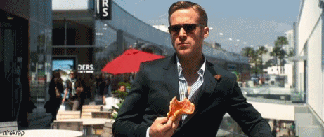 Holding a piece of pizza makes you look cool.