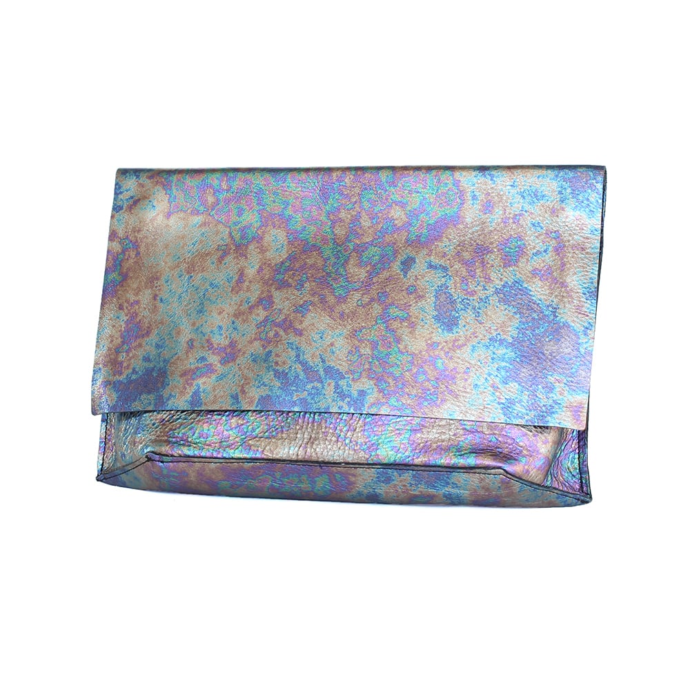I'm a sucker for the oil-slicked look of this Tracey Tanner Slick Carmen Flap Clutch ($235). It's metallic without being too flashy, perfect for a night out for drinks.

— AM