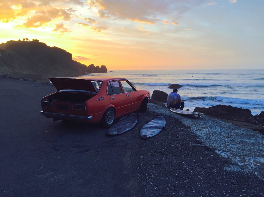 "Capturing the moods of different colors, like the warm yellows and cool blues seen here, helps tell this photo’s story: The sun sets on a day of surfing."