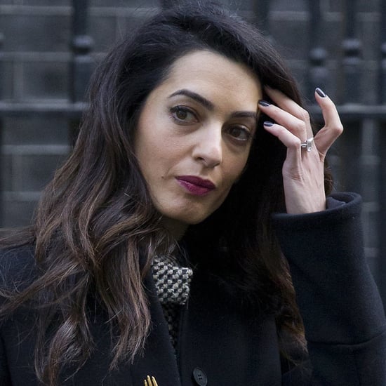 Amal Clooney Wearing a Black Coat With Gold Buttons