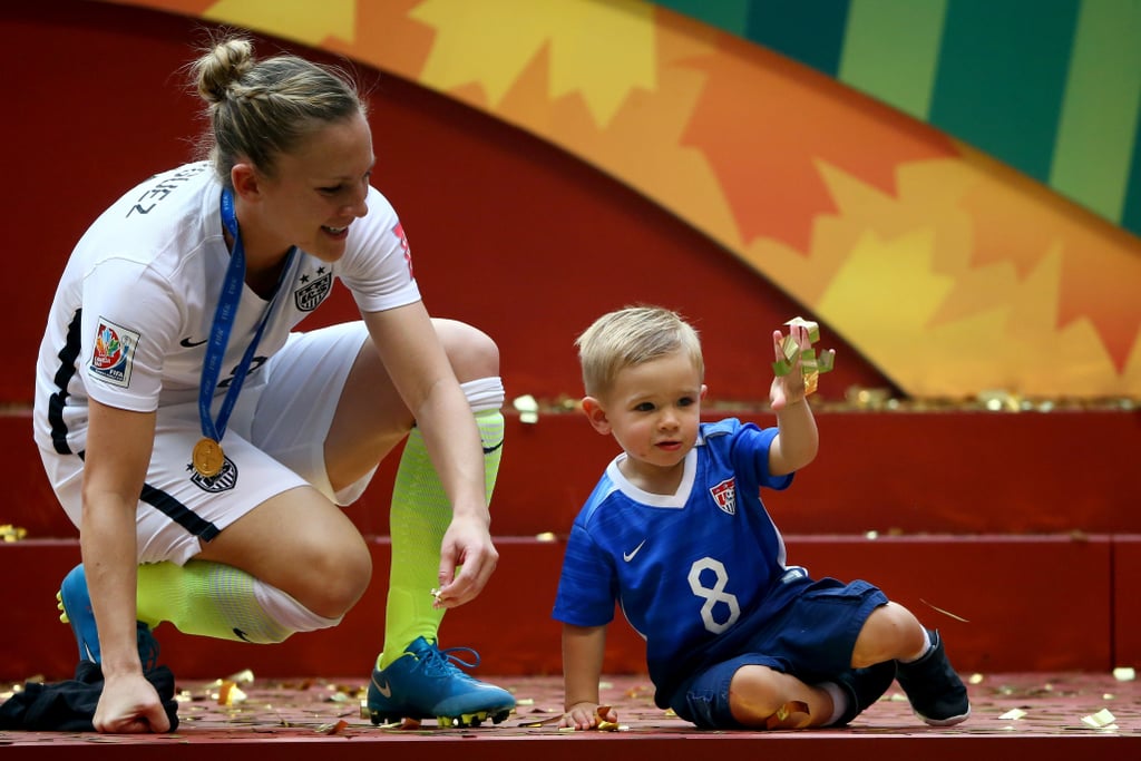 Amy Rodriguez and Son After World Cup Win