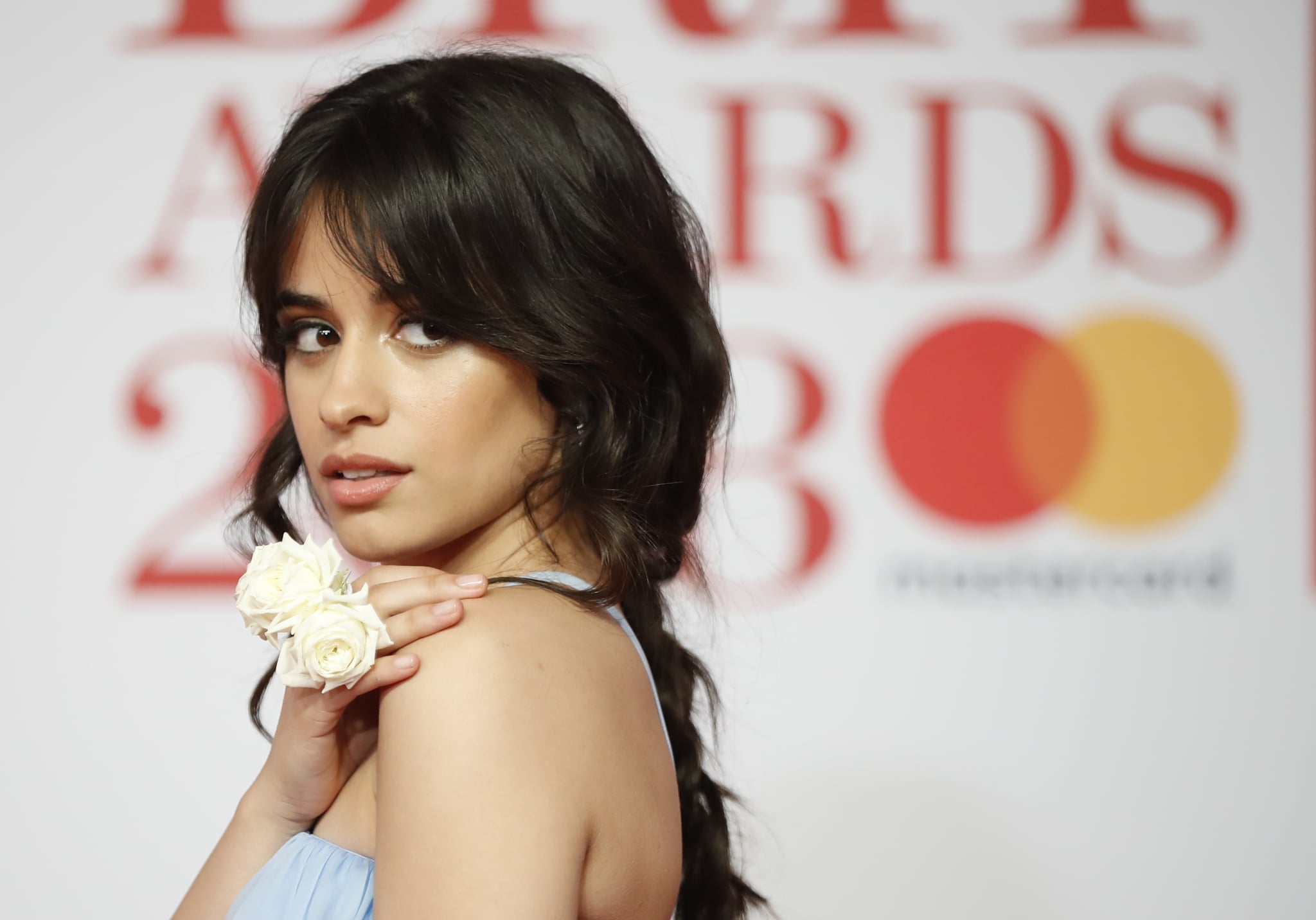 Cuban-born singer-songwriter Camila Cabello poses on the red carpet on arrival for the BRIT Awards 2018 in London on February 21, 2018. / AFP PHOTO / Tolga AKMEN / RESTRICTED TO EDITORIAL USE  NO POSTERS  NO MERCHANDISE NO USE IN PUBLICATIONS DEVOTED TO ARTISTS        (Photo credit should read TOLGA AKMEN/AFP/Getty Images)