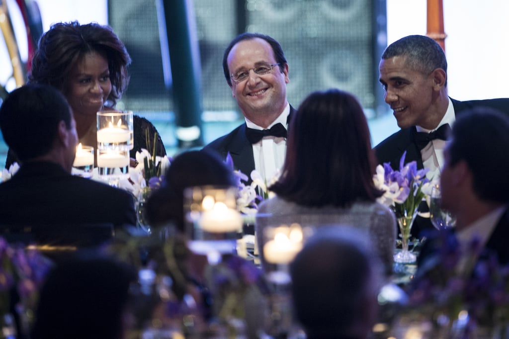 President Hollande took pride in his spot between his hosts.