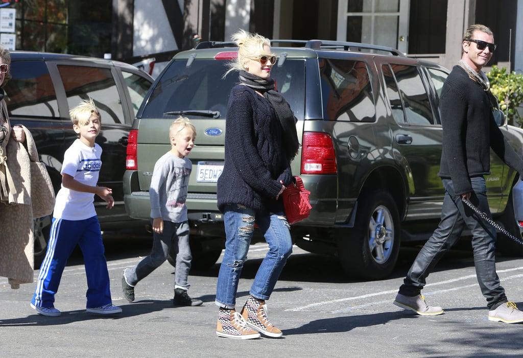 Keeping her look and her bump casual, Gwen rocked an oversize sweater and kicks during an outing with the whole fam.