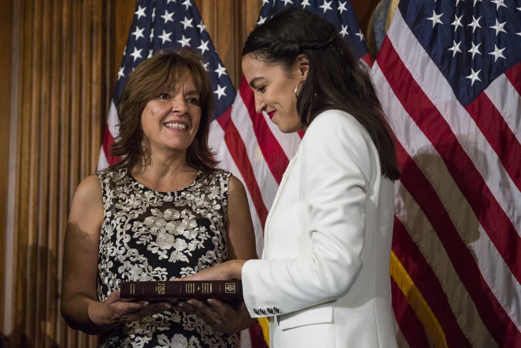 Alexandria wore gold hoops and a white suit for the mock swearing-in ceremony on Capitol Hill on Jan. 3, 2019.