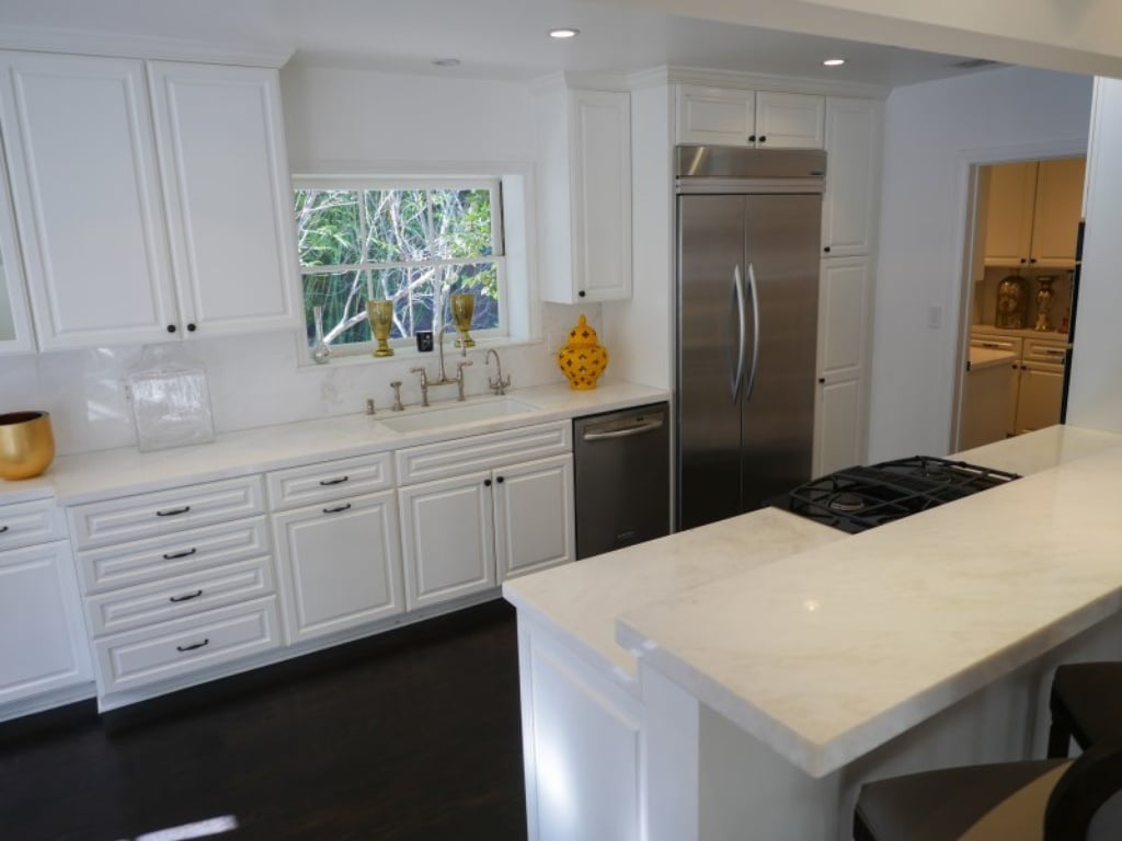 The kitchen's white granite counter tops give the space a clean finish. 
Source: Sotheby's Realty