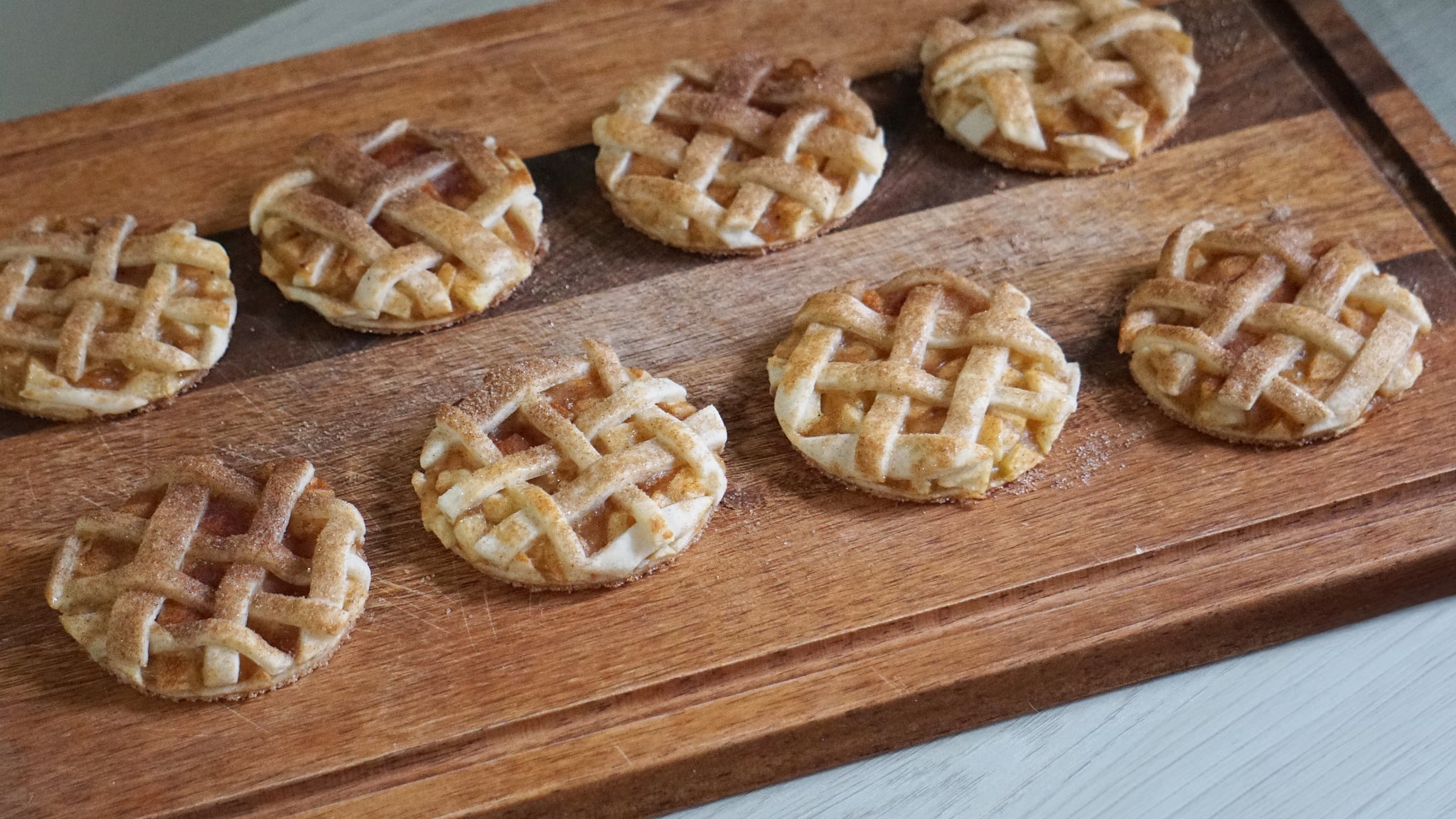 apple pie cookies: finished cookies on a wooden cutting board