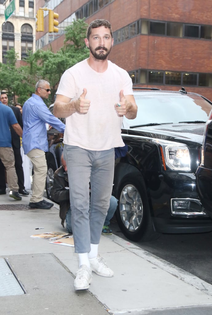 A simple t-shirt with grey jeans can go a long way with a couple of thumbs up signs.