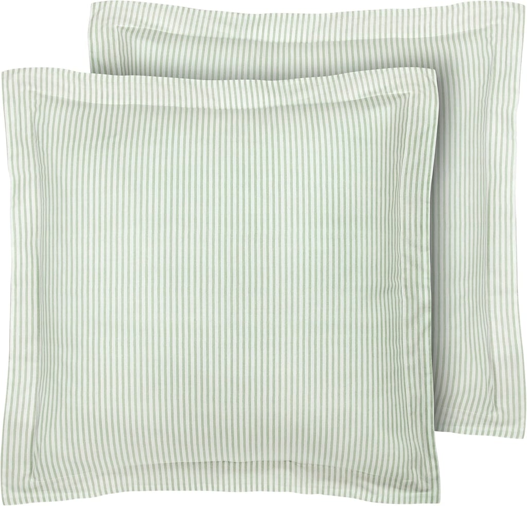 Laura Ashley European Shams ($27, originally $40)
Give your bedding a fall reset by swapping in fresh pillow covers. This set of green-and-white striped shams are equal parts cozy and chic. Simply changing new covers is much more cost effective than buying entirely new statement pillows.