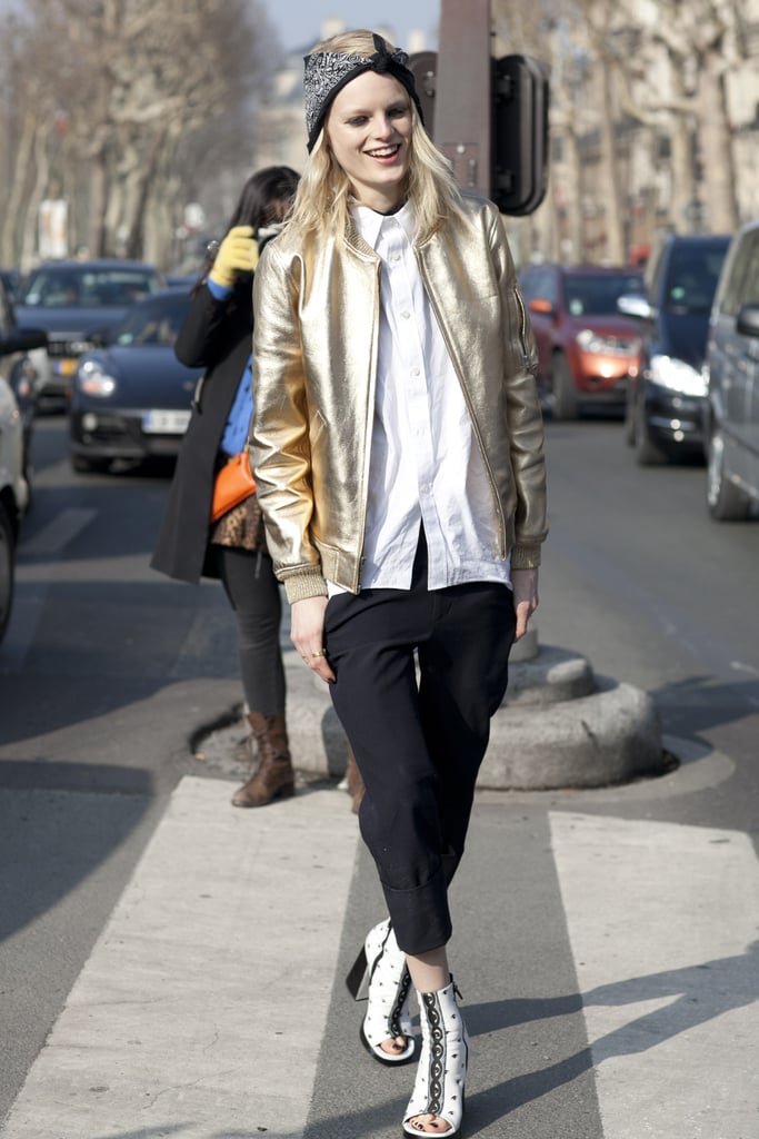 Hanne Gaby Odiele dressed up a classic white button-down and trousers with sandal boots and a metallic bomber.
Hanne Gaby Odiele dressed up a classic white button-down and trousers with sandal boots and a metallic bomber.