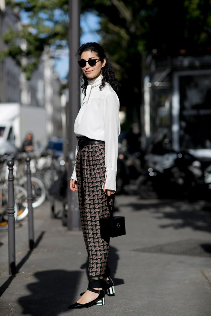 Caroline Issa remixes traditional trousers and a pretty blouse, just by adding a touch of the trends.