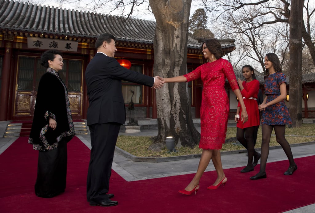 Michelle and her daughters were greeted by the Chinese president in Beijing.