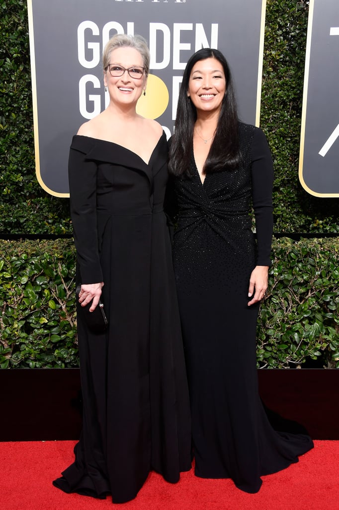 Meryl Streep used her platform to give a voice to the voiceless at the 2018 Golden Globes. The actress, who is nominated for her work in The Post, showed up at the event with Ai-jen Poo, the director of Domestic Workers, an alliance which works toward building fairness and equality for women in the workplace. Before hitting the red carpet, Meryl took a selfie with Ai-jen, who said she was joining the Oscar award winner to shine "a spotlight on domestic workers [and] people who are particularly vulnerable to abuse in the workplace." Meryl was just one of many women who walked the red carpet with activists as their date in honor of the Time's Up movement following the recent wave of sexual harassment allegations in Hollywood. Read on to see more photos of Meryl's night out at the Globes ahead.