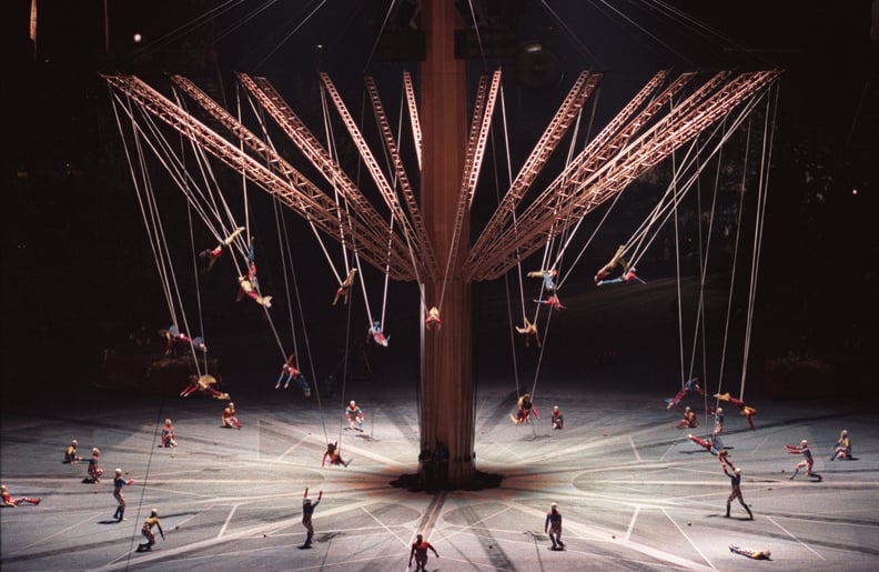 People were flying around on a giant carousel.