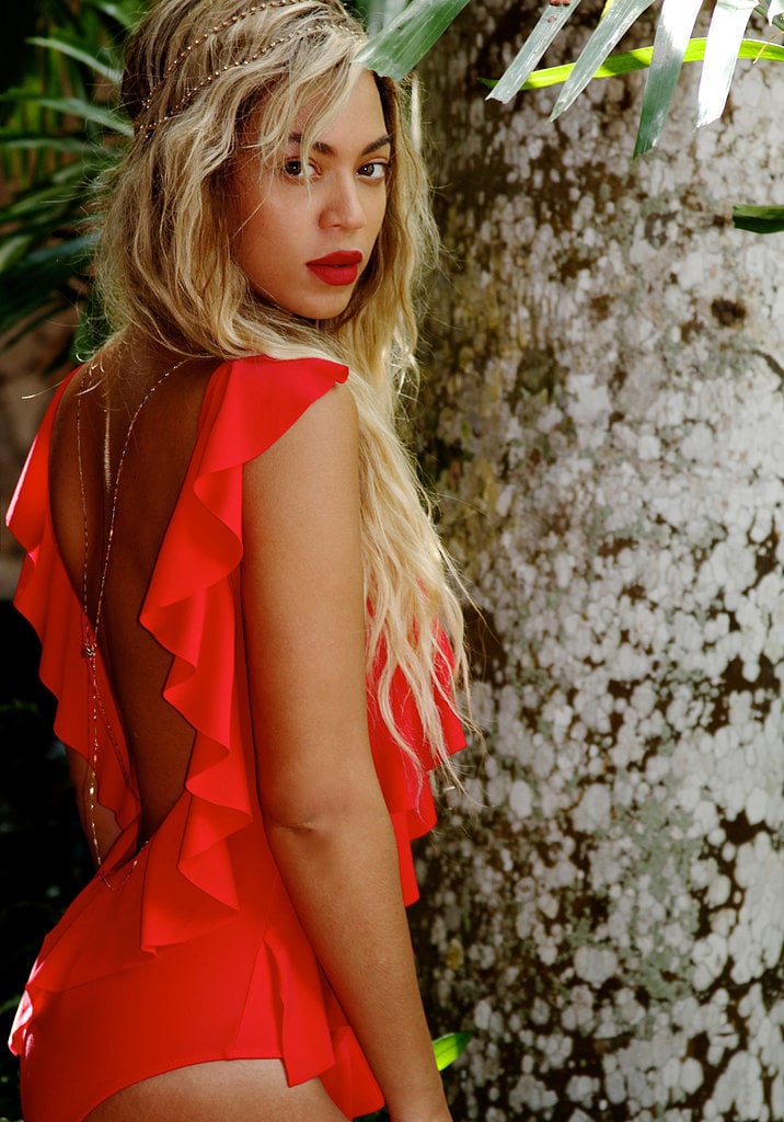 Between the ruffles and the bright red, this suit was made for turning heads. Note the matching lip.
Source: Tumblr user Beyoncé Knowles